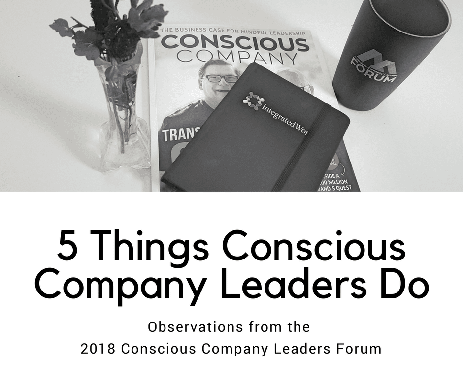 Picture of Conscious Company Magazine, an Integrated Work Notebook, a mug from the Conscious Company Leaders Forum, and a vase of flowers